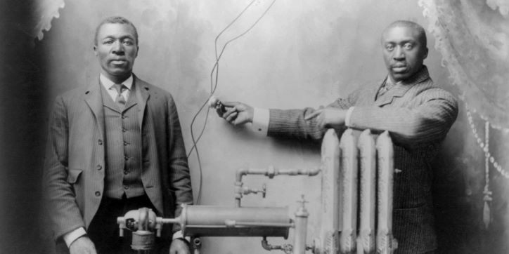 Antique image Inventor Charles S.L. Baker with heating system, c. 1906. Courtesy Library of Congress.