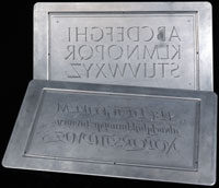 Two engraved metal printing plates. Calligraphy by Hermann Zapf. Click to enlarge.