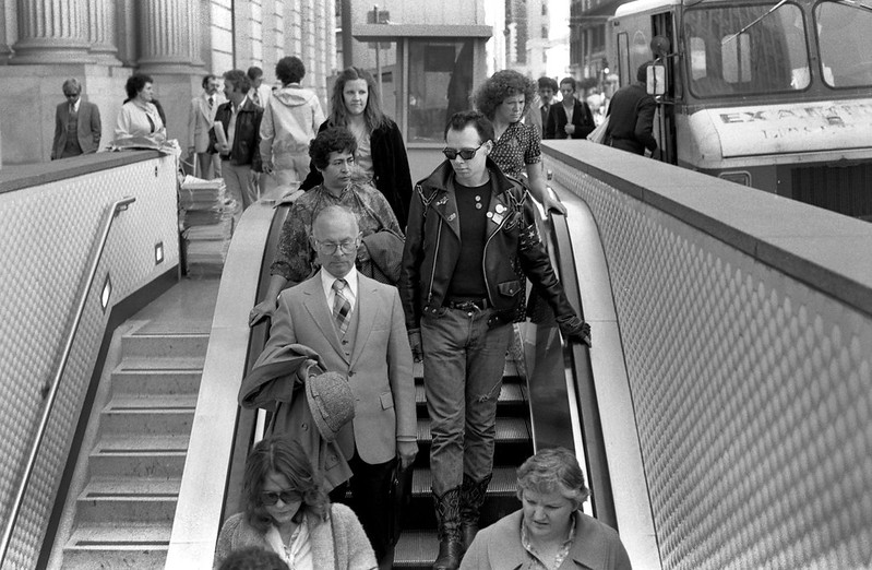 People on an escalator on Market Street