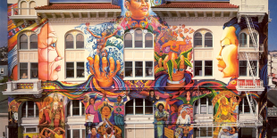 Colorful mural covering the exterior of the front of the Women&#039;s Building.