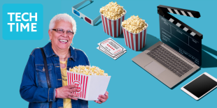 woman holding a bowl of popcorn, laptop, 3d glasses and more popcorn in background