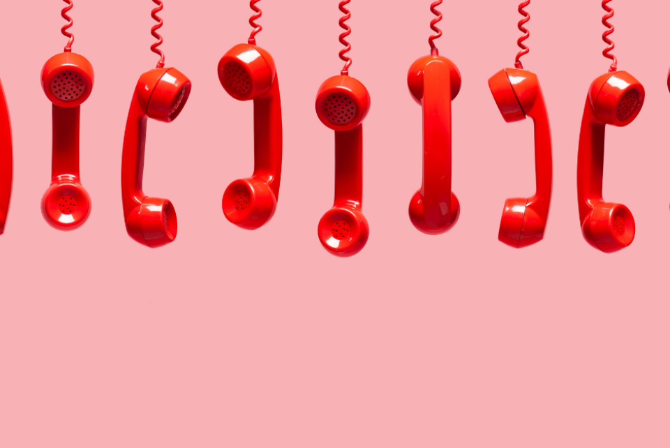 Dangling red phone receivers