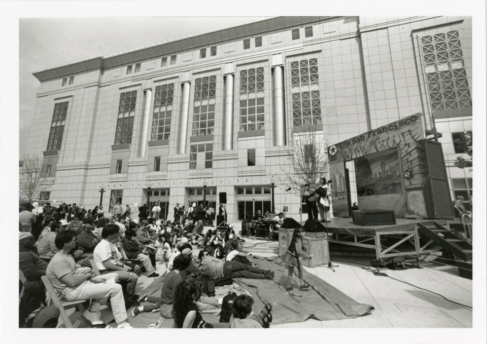 People watching S.F. Mime Troupe outside Main Library, 1996