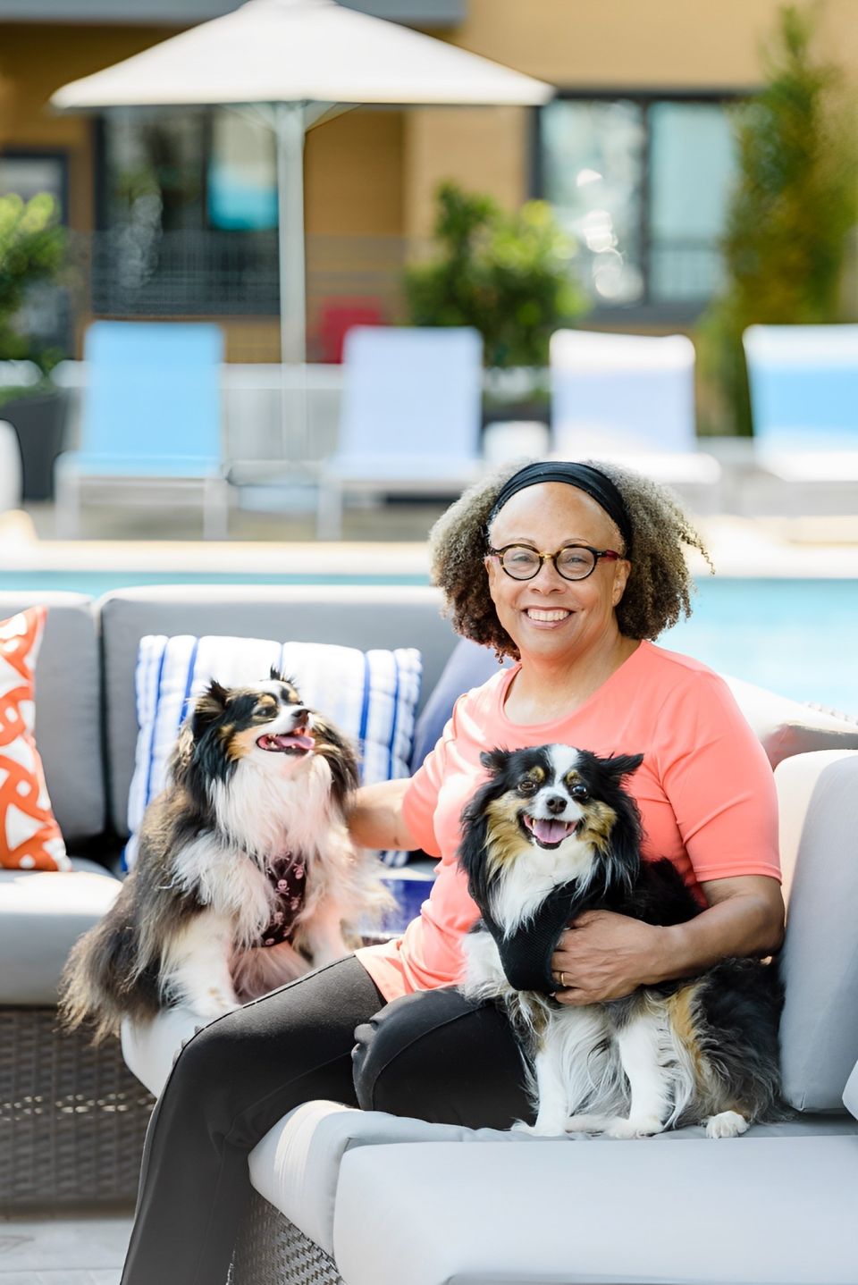 headshot of author with two dogs