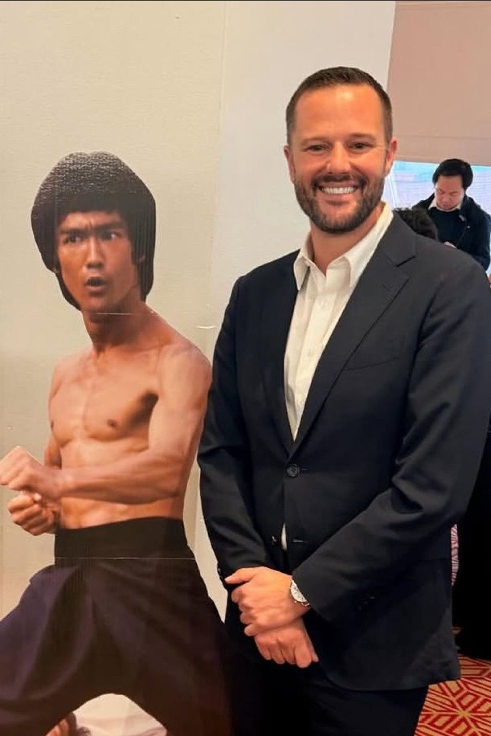 Assemblymember Matt Haney with a cutout of Bruce Lee.