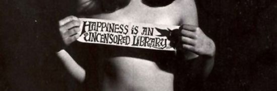 Person holding a sign saying &quot;Happiness is an uncensored library&quot;