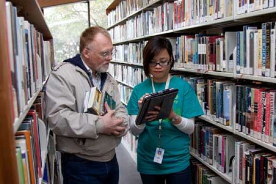 librarian assisting patron