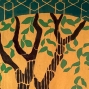A detail of a hand-dyed textile depicts the upper branches of a brown tree with green leaves on a yellow background. Arching above the branches is a dark green arch with thin yellow lines forming geometric patterns.